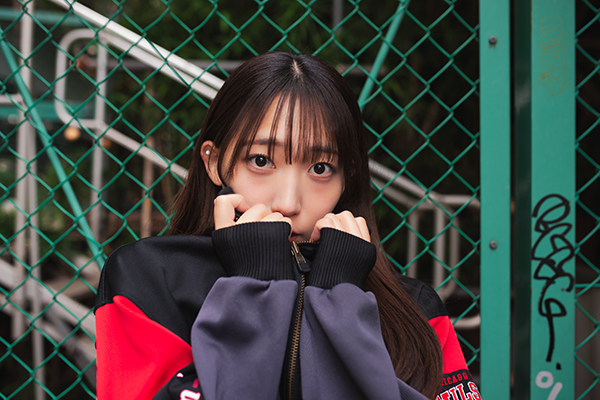 269.Hau. wearing Wilson tracktop